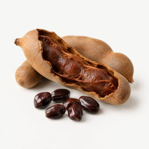 A split tamarind pod with seeds